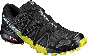 A black and yellow Salomon sports shoe with an aggressive tread pattern for trail running.