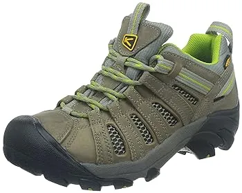 A single olive green hiking shoe with yellow accents and laces on a white background.